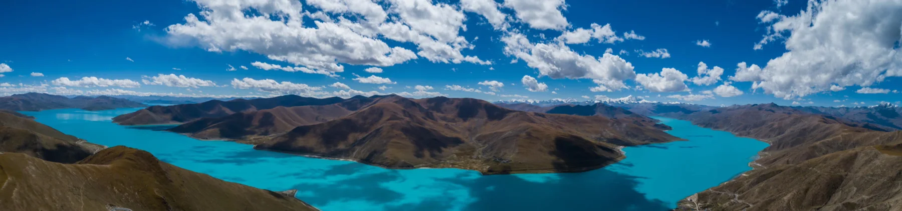 Turquoise water and mountain shoreline at Yamdrok Lake, Tibet